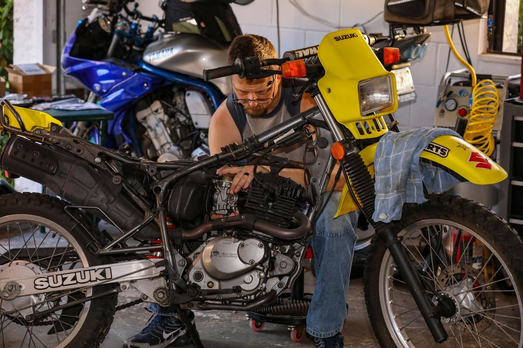 Two-wheelers being serviced in a workshop
